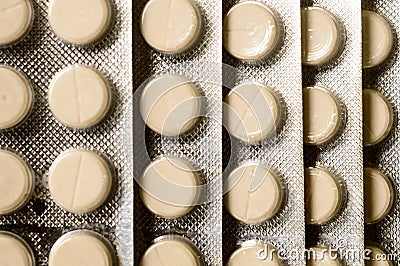 Heap of Capsules packed in blisters, round patterned shaped medicine tablet or antibiotic pills. Medical Pharmacy theme. Close up Stock Photo