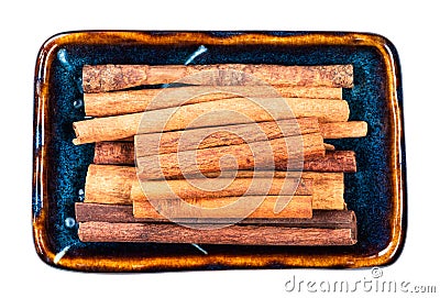 Heap of chinese cinnamon Cassia in bowl cutout Stock Photo
