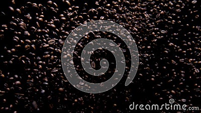 Heap coffee beans exploding close up. Roasted aromatic seeds flying on camera. Stock Photo