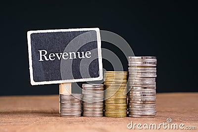 Heap Coins and Revenue Sign Stock Photo