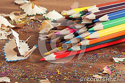 Heap of colored pencils, wooden background Stock Photo