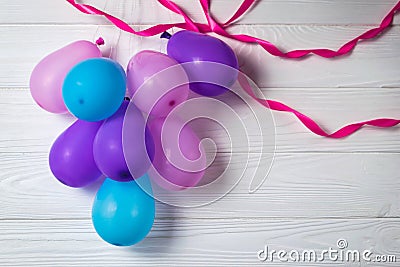 Heap of colorful balloons on white background with ribbons Party birthday card Stock Photo