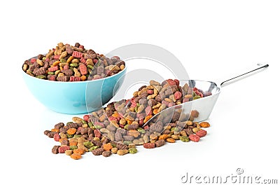 Heap of dry pet food in metal scoop and plastic bowl Stock Photo