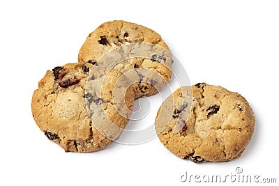 Heap of fresh baked chocolate cranberry cookie close up on white background Stock Photo