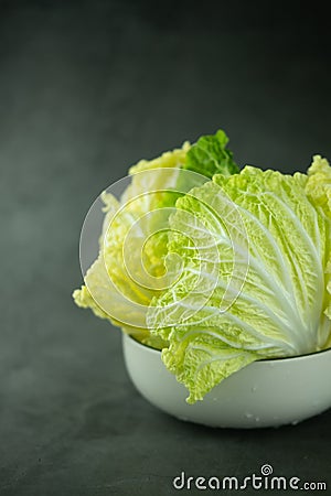 Heap fresh of green chopped iceberg lettuce in bowl Stock Photo