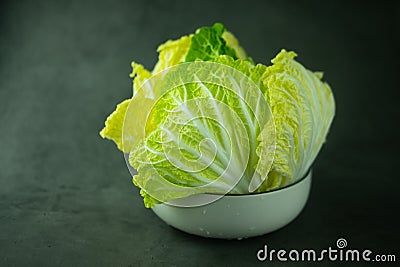 Heap fresh of green chopped iceberg lettuce in bowl Stock Photo