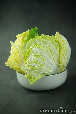 Heap fresh of green chopped iceberg lettuce in bowl Stock Photo