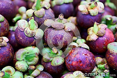 A heap of fresh purple mangosteens Stock Photo