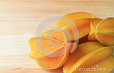Fresh Ripe Star Fruits or Carambola Isolated on Wooden Table Stock Photo