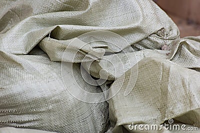 Heap of green fabric bags Stock Photo