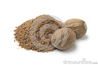 Heap of ground nutmeg and whole nutmeg seeds Stock Photo