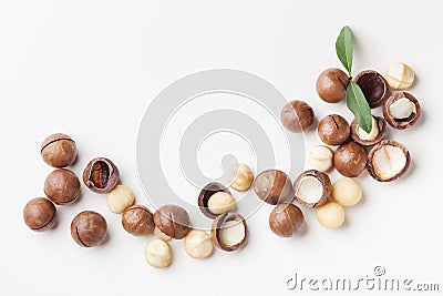 Heap of macadamia nuts on white table top view. Stock Photo