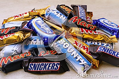 Heap of Mars, Snickers, Milky Way, Bounty and Twix chocolate can Editorial Stock Photo