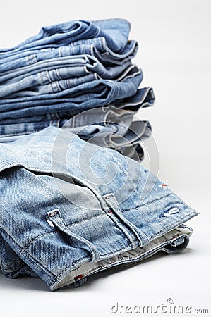 Heap of modern designer blue jeans Stock Photo