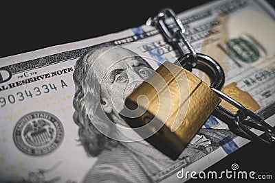 Heap of money in chain with padlock on black. Business safety or financial protection or restriction access. concept of Stock Photo