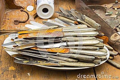 Heap of old rusty knives for sale at the bazaar Stock Photo