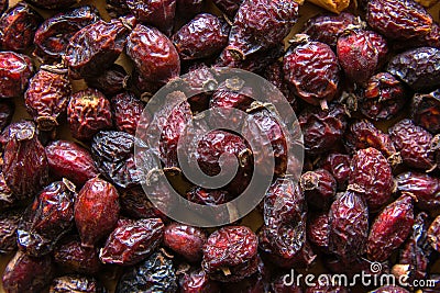 Heap of organic sun dried fruits berries dehydrated rose hip. Healthy diet wholefoods vegan winter beverages ingredients concept Stock Photo