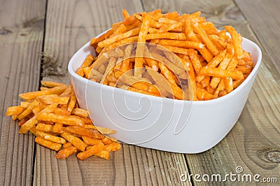 Heap of Potato Sticks in a bowl Stock Photo