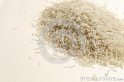 A heap of raw basmati rice. Concept of Water-Conserving Products. Saving water. Stock Photo