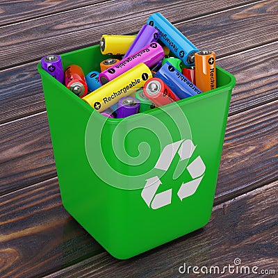 Heap of Rechargeable Batteries in Green Bucket with Recycle Sign Stock Photo