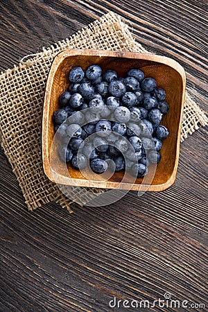 heap ripe sweet blueberries on wooden table top view Stock Photo