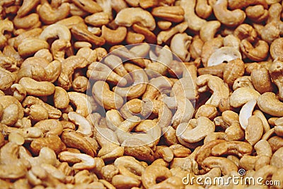Heap Roasted cashew nuts, texture background Stock Photo