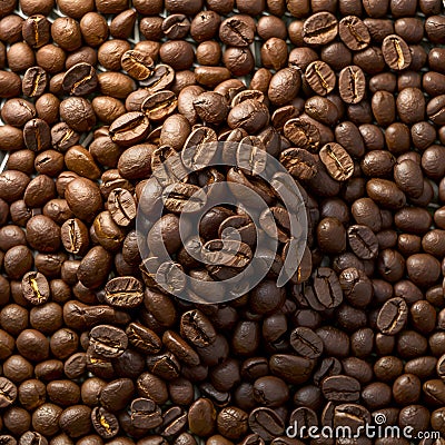 Heap of roasted coffee beans arranged intricately on a matting Stock Photo