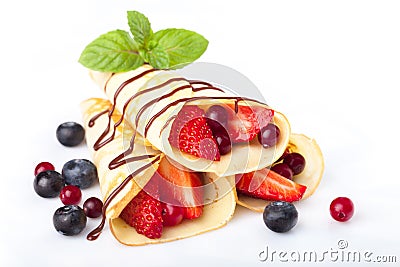 Heap of rolled pancakes with berries isolated on Stock Photo
