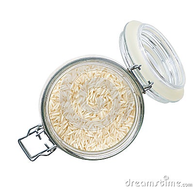Heap of uncooked long rice basmati grains in glass storage jar isolated on white background top view Stock Photo