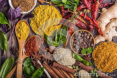 Heaps of various ground spices on wooden background. Georgian spices, Indian spices, Arabian spices. Spice variety. Herbs and spic Stock Photo
