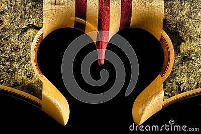 Cut out heart on a Maple, Purple Heart and Buckeye Burl Exotic Wood Bass Guitar Stock Photo