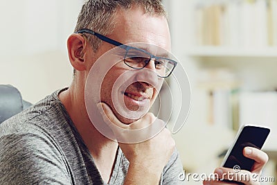 Hearing impaired man with hearing aid Stock Photo