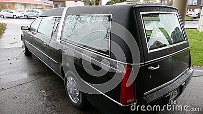 Hearse arriving or leaving a funeral due to the Increasing death from Corona virus and Covid 19 pandemic outbreak Editorial Stock Photo