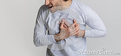 Heart attack concept. Man screams in pain. Stock Photo