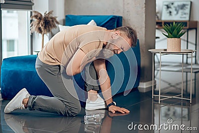 A mature bearded man having a heart attack and feeling bad Stock Photo