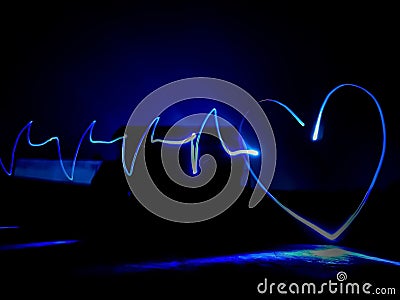 Heart with heart beat neon image for loved one& x27;s Stock Photo