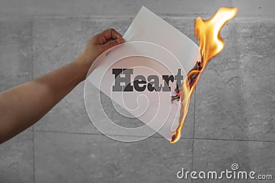 Heart burn text on burning paper Stock Photo