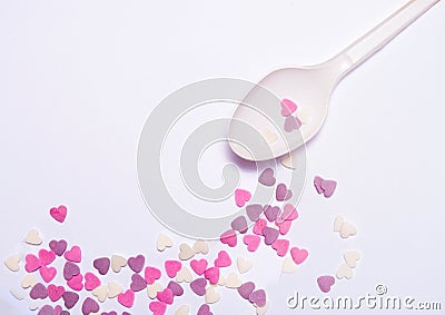 Heart candies on white spoon Stock Photo