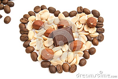 Heart of coffee beans, chocolate, peanuts and hazelnuts Stock Photo