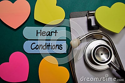 Heart Conditions write on sticky note isolated on Office Desk. Healthcare or Medical Concept Stock Photo