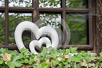 Heart decoration on an old wooden window Stock Photo