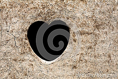 Heart on dirt wall Stock Photo