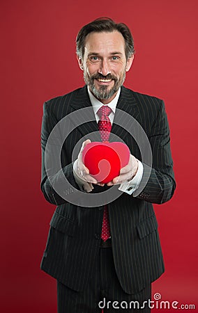 Heart donor. I love you so much. Happy man with big red heart. Love and romance health care. February holiday. mature Stock Photo