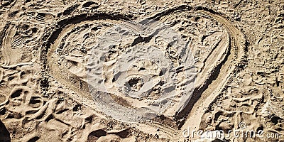 A heart drawed in the sand beach Stock Photo