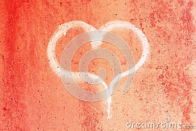 Heart drawn in chalk on a red concrete wall Stock Photo