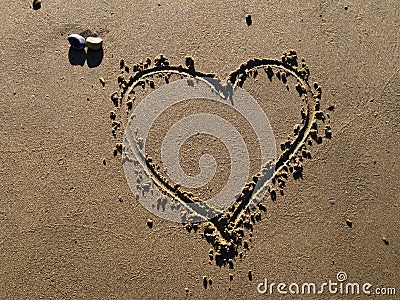 A Heart drawn in sand Stock Photo