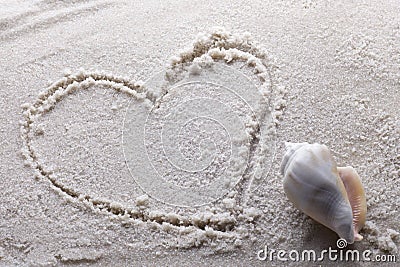 Heart drawn in sand Stock Photo