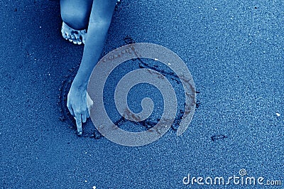 Heart drawn on sand Stock Photo