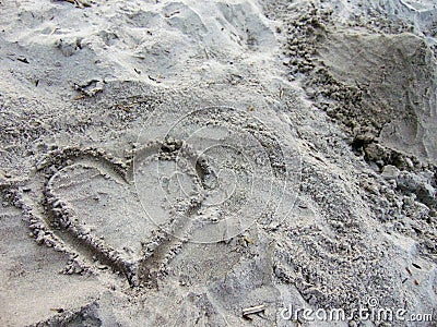 Heart drawn in the sand Stock Photo