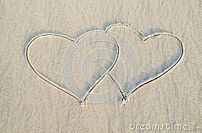 Heart drawn on sand Stock Photo